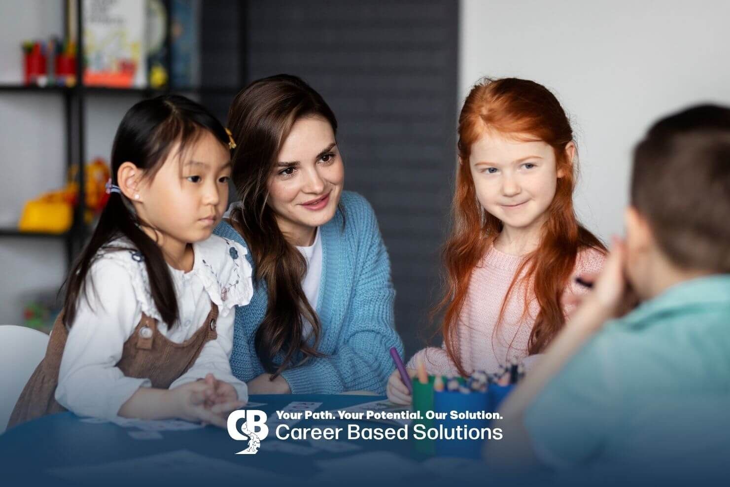 Therapist engaging with autistic kids during a classroom activity & supporting communication