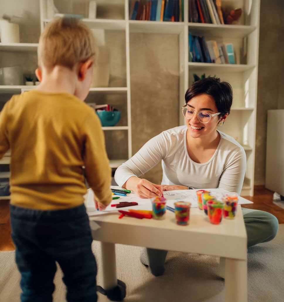 ABA therapist working with a child during therapy session in Fredericksburg clinic