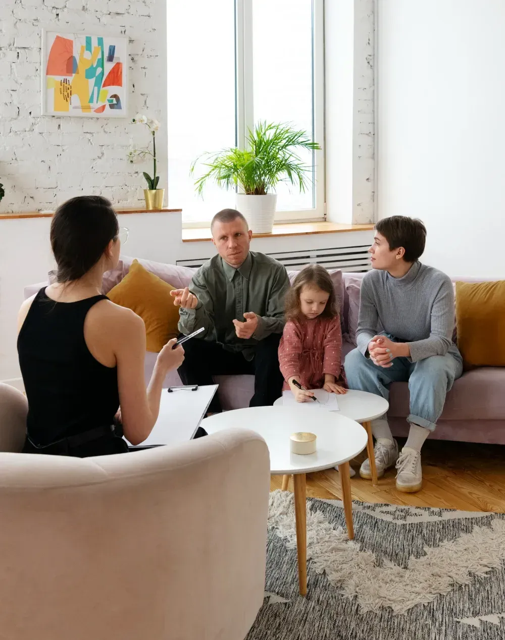 ABA therapist working with a child during therapy session in Fredericksburg clinic