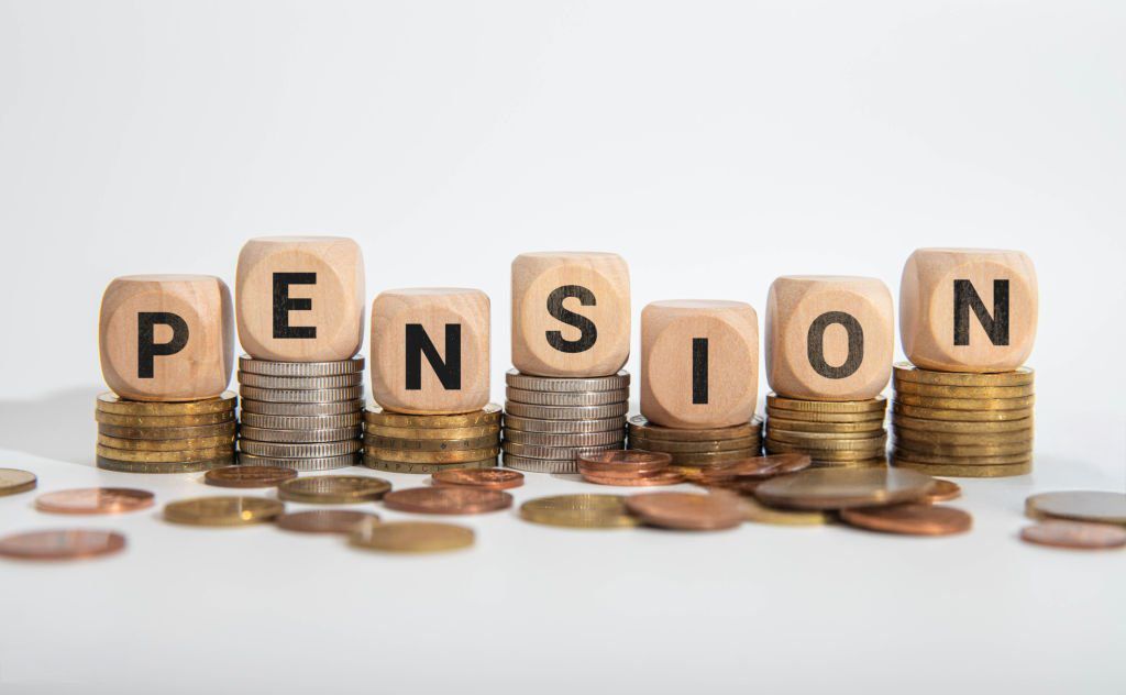 Image of wooden dice arranged in horizontally spelling out the word PENSION