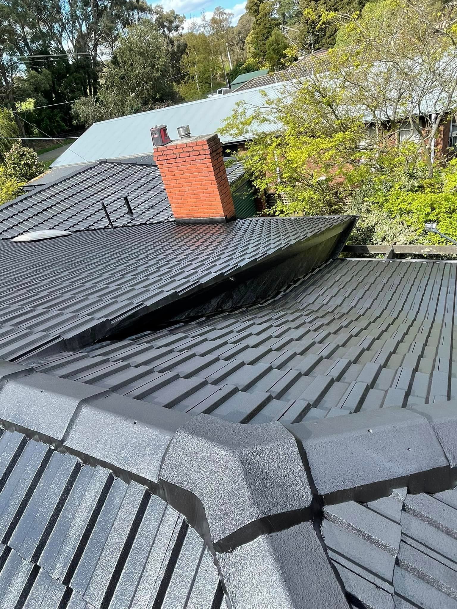 A close up of a roof with a chimney on it