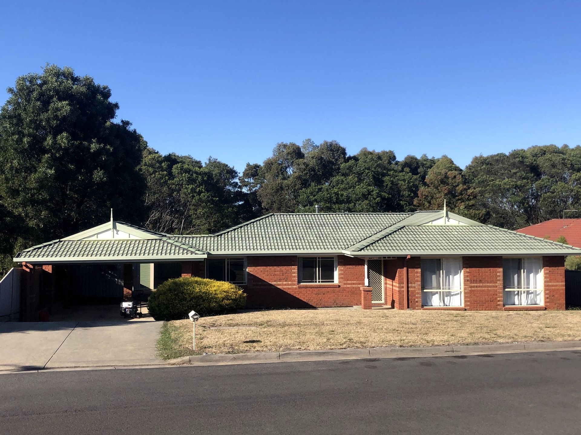 A man is standing on the roof of a house