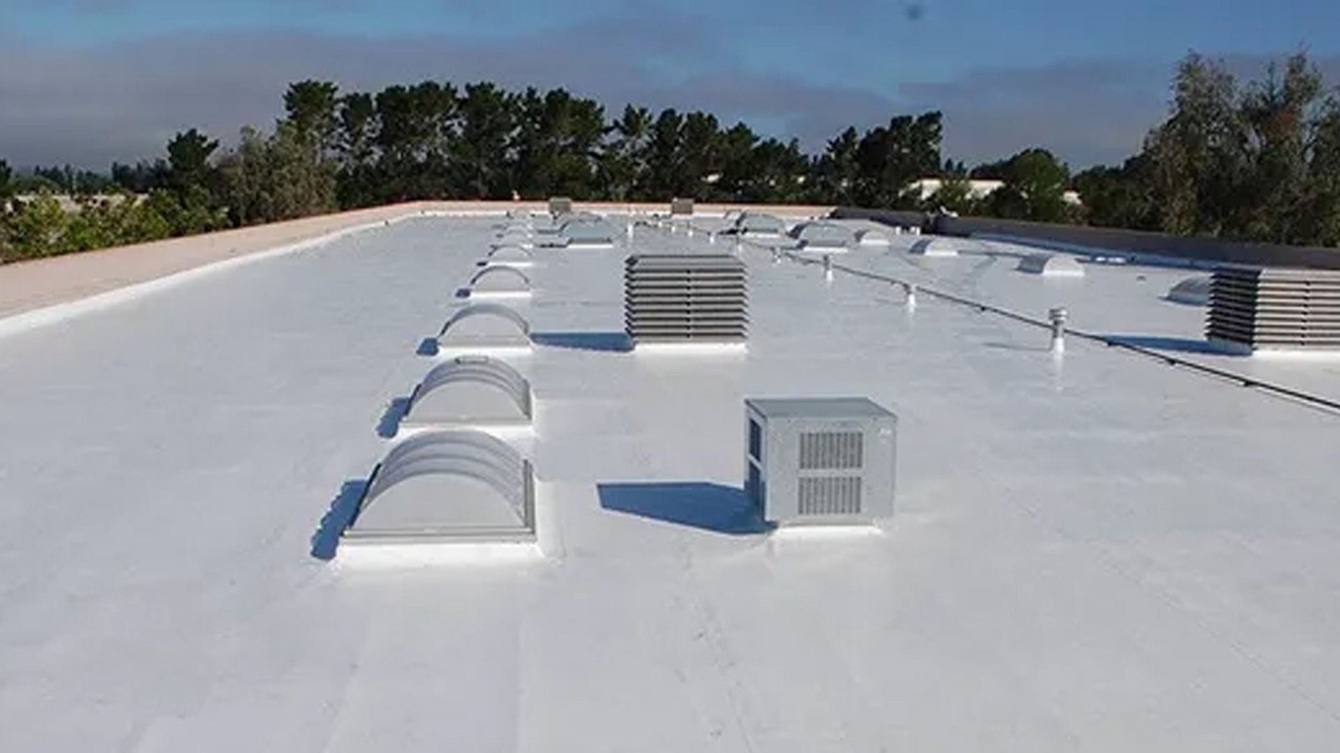 a white roof with a lot of vents on it