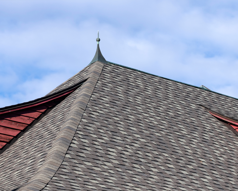 a roof with a steeple on top of it