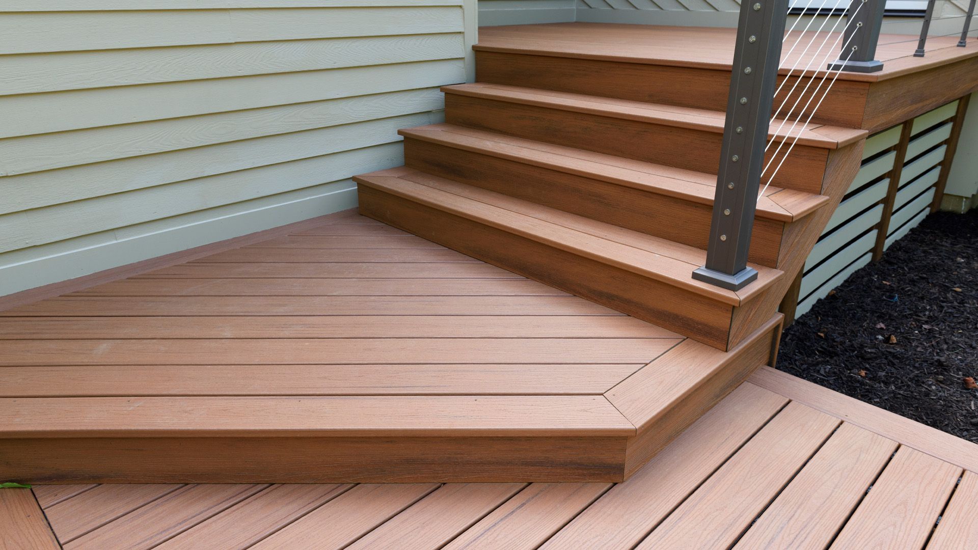 a wooden deck with stairs leading up to it