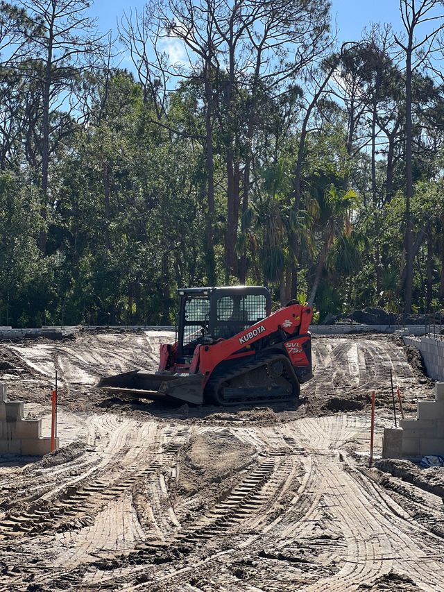 A bulldozer is digging a hole in the ground.