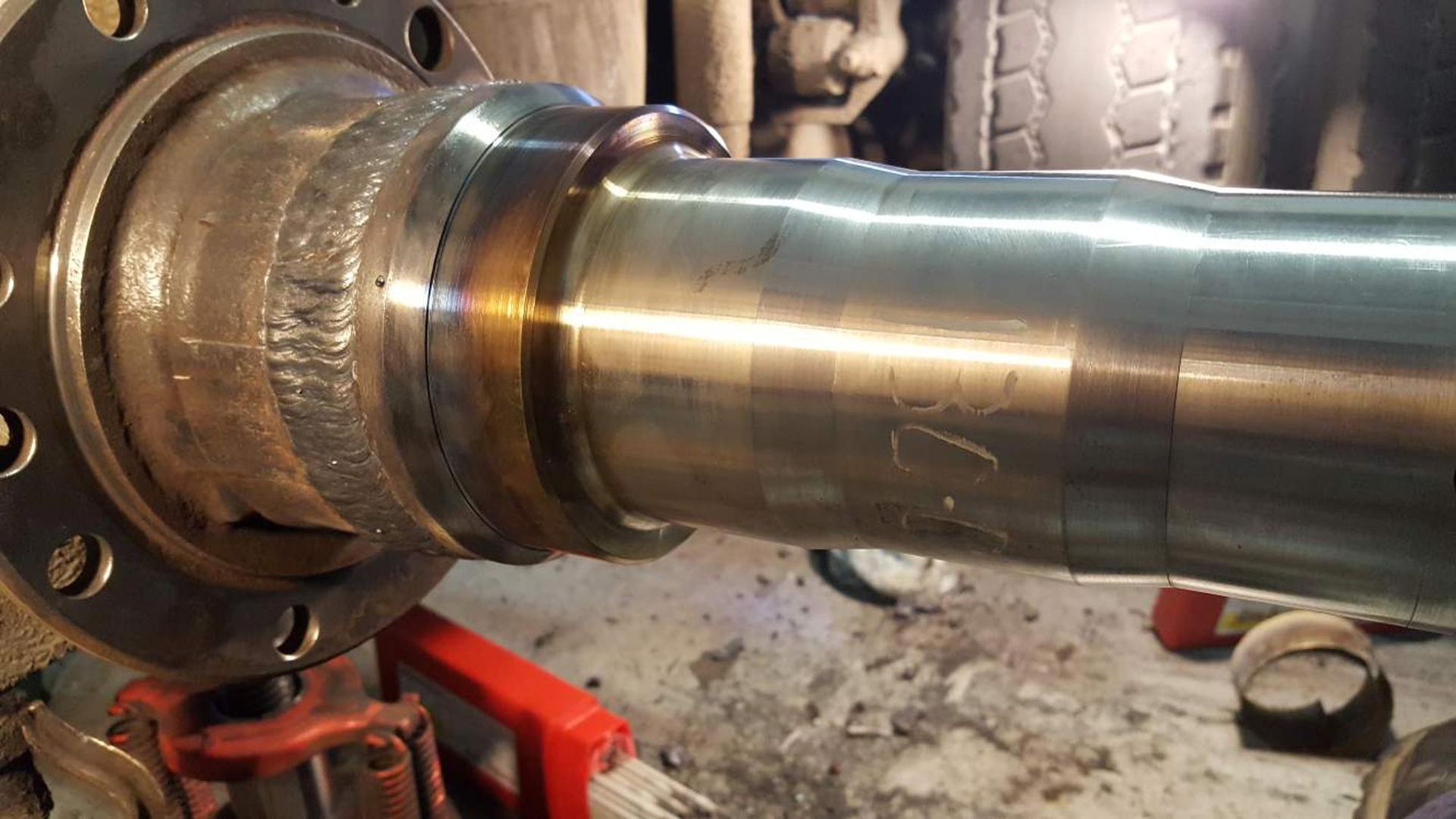 A close up of a metal pipe sitting on top of a table.
