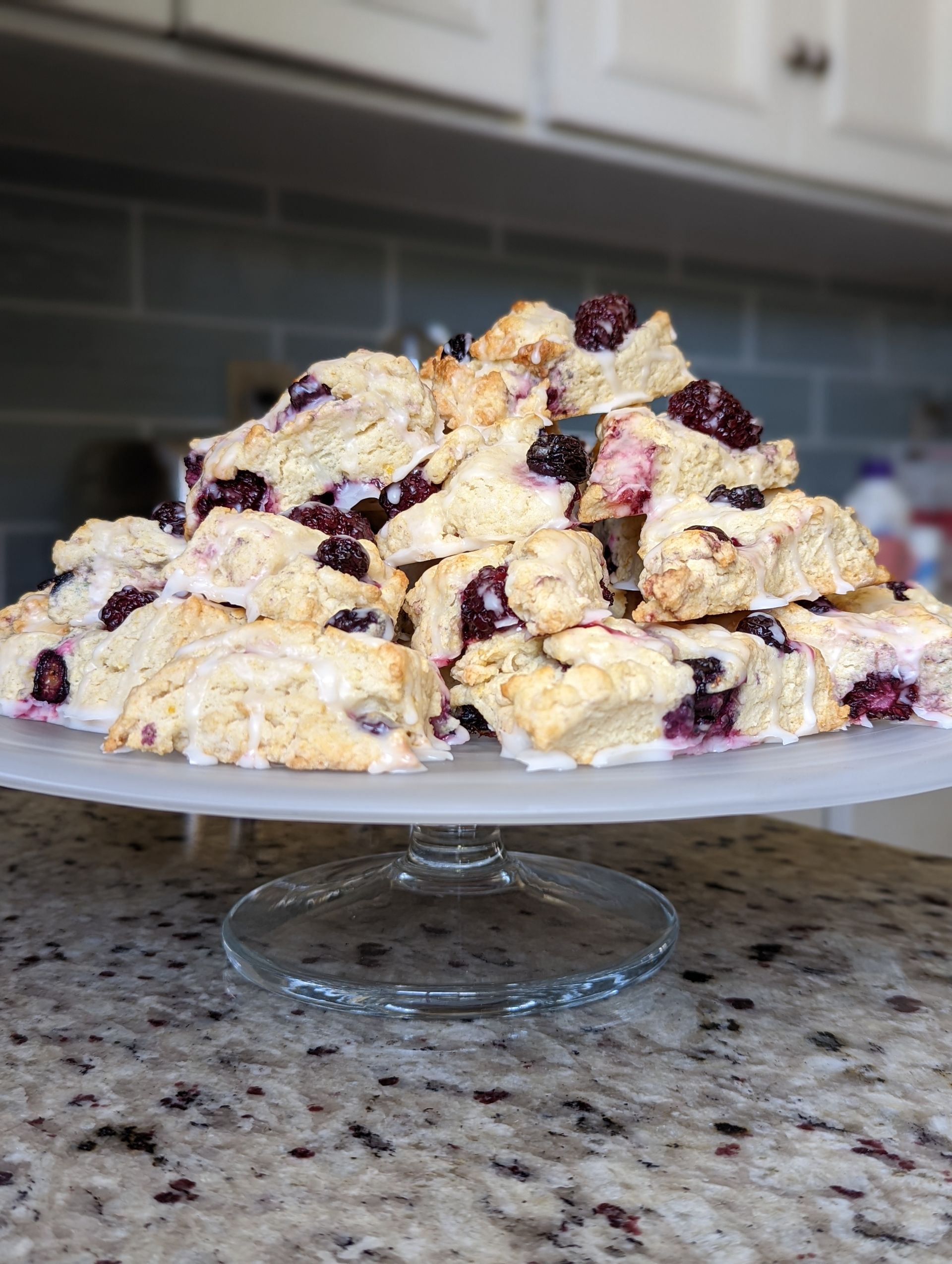 Pile of lemon blueberry scones on platter