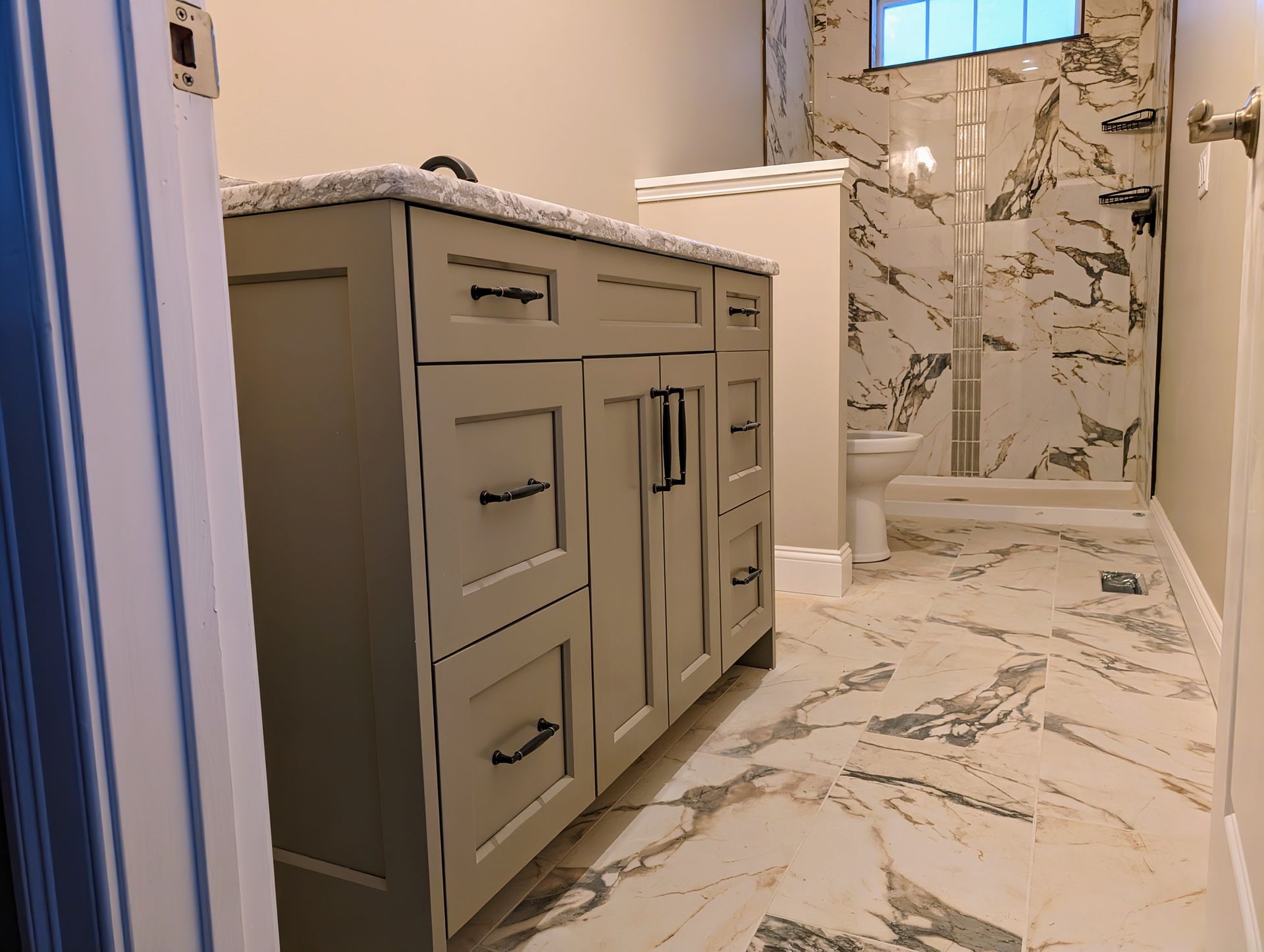 Bathroom vanity, tile, shower. Work completed by us.