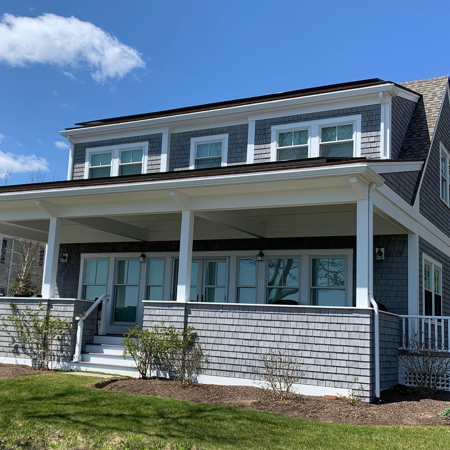 Cape Cod home's front porch and bright windows professionally cleaned