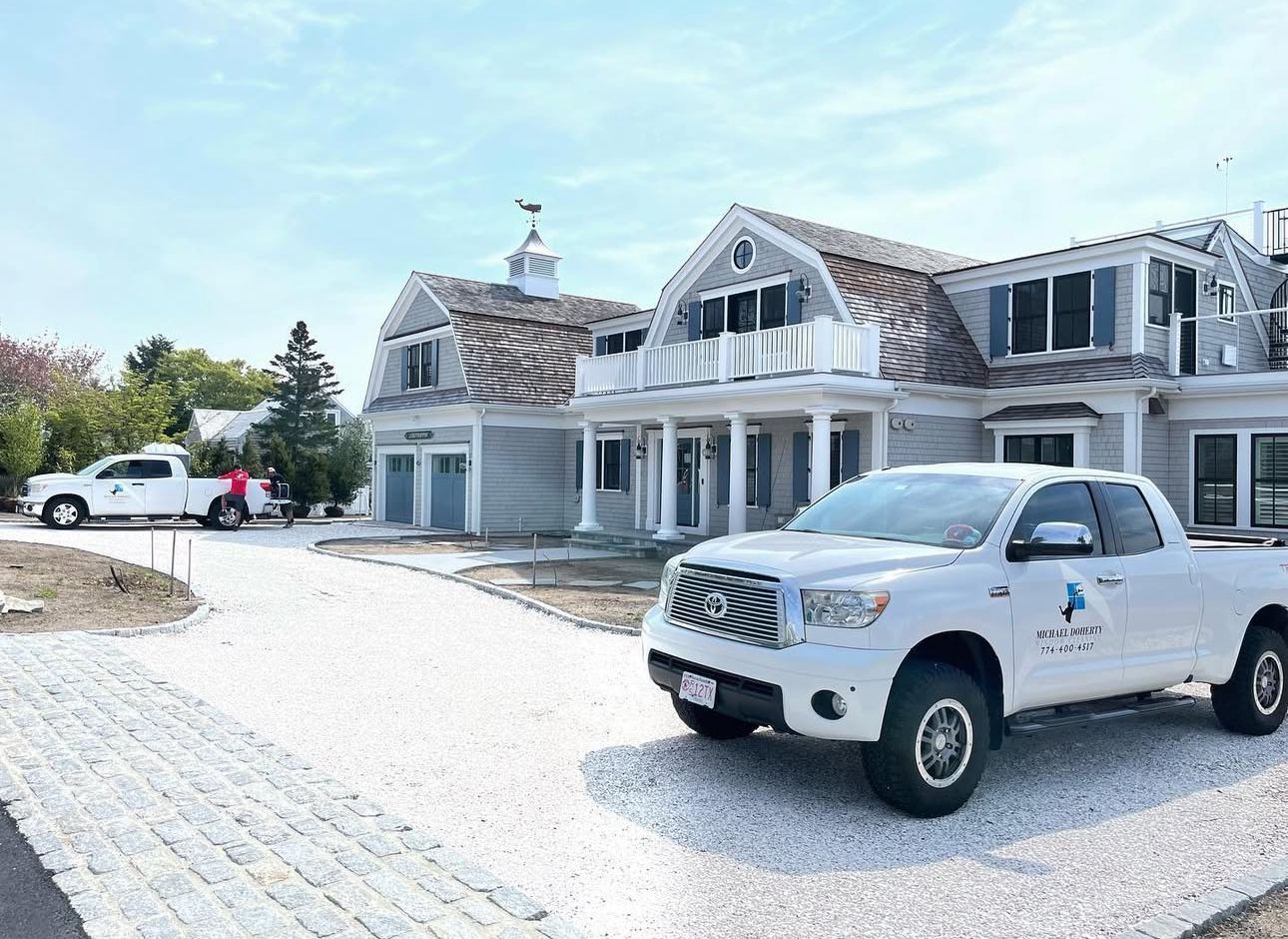 Michael Doherty Window Cleaning team and trucks at Cape Cod home project | Window cleaning services
