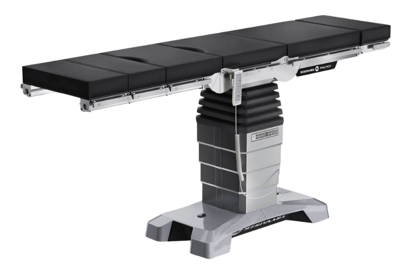 A surgical operating room table with a black cushion on it