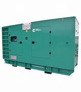 Green Cummins generator in an outdoor setting.