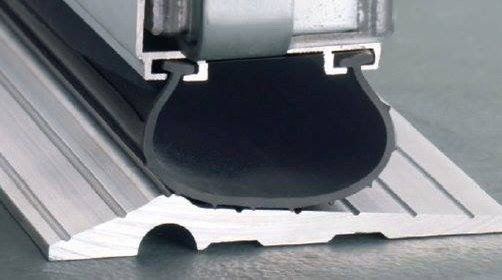 A close up of a rubber seal on a metal surface.