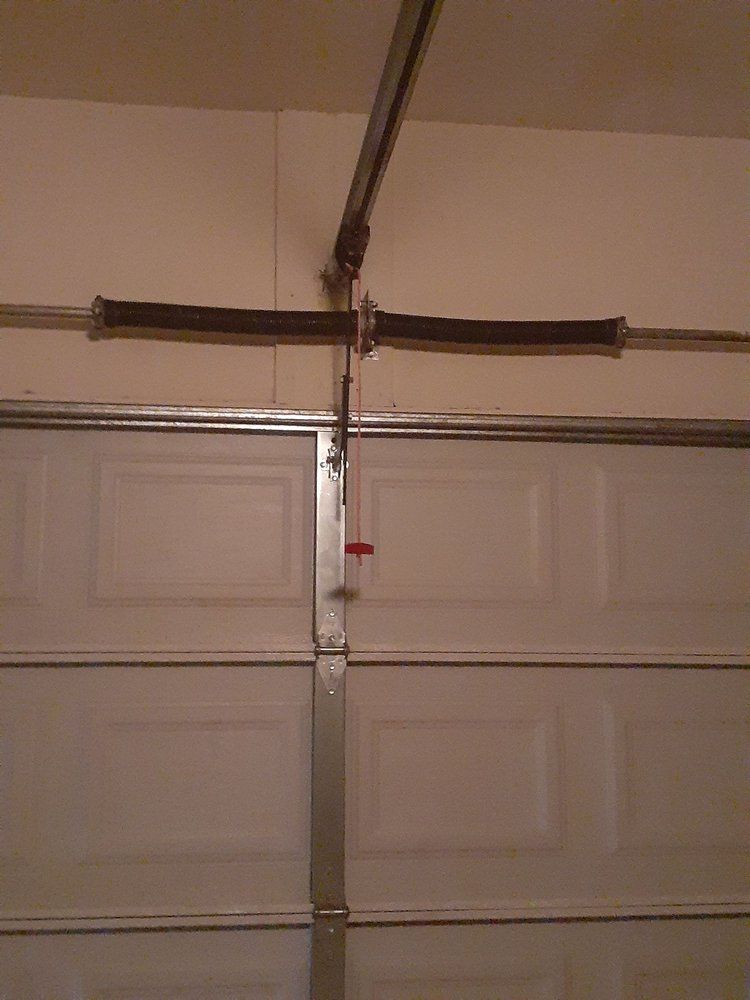 A garage door with a broken spring in it