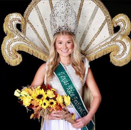 A woman is wearing a sash that says texas rice festival