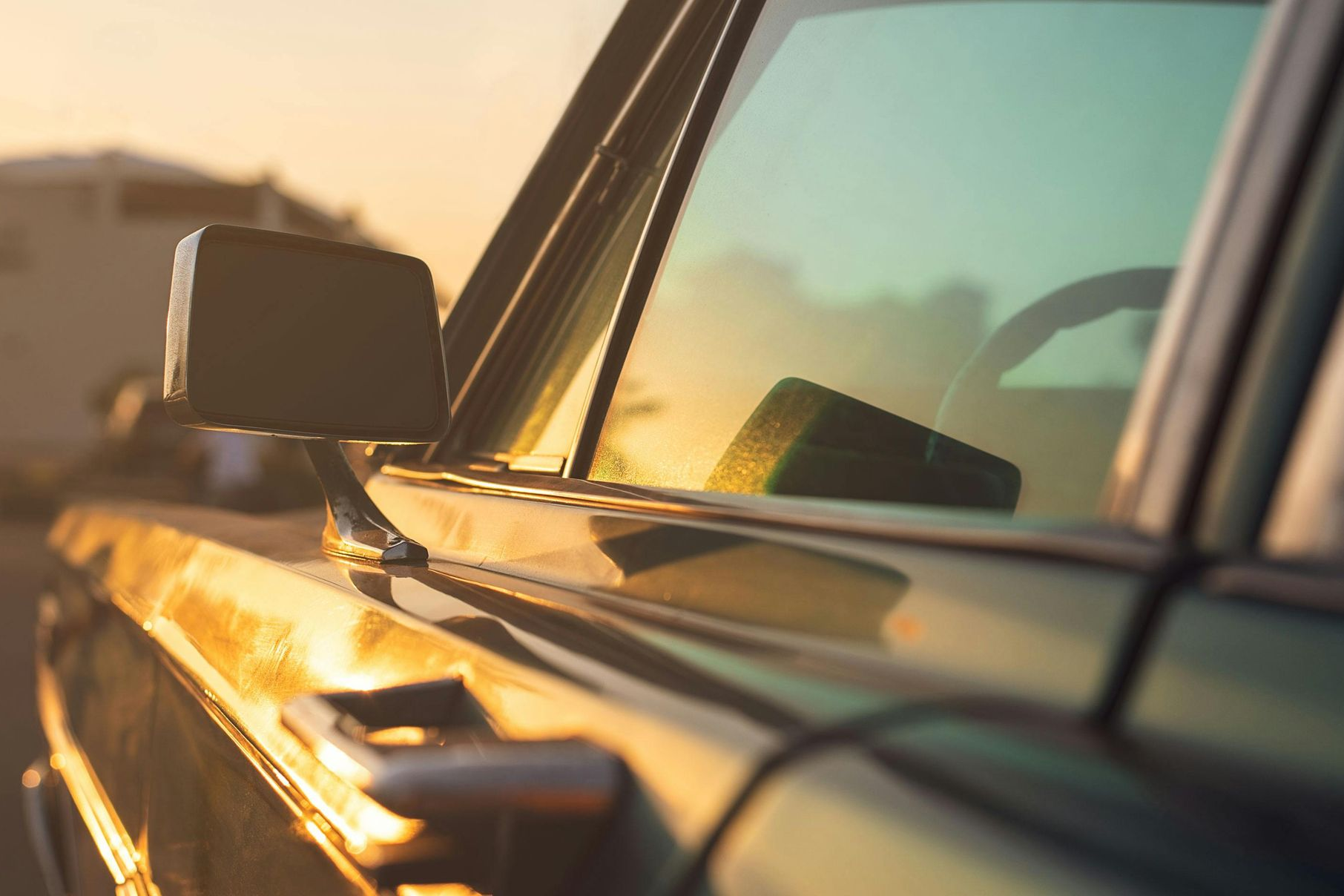 A close up of the headlights of a black car