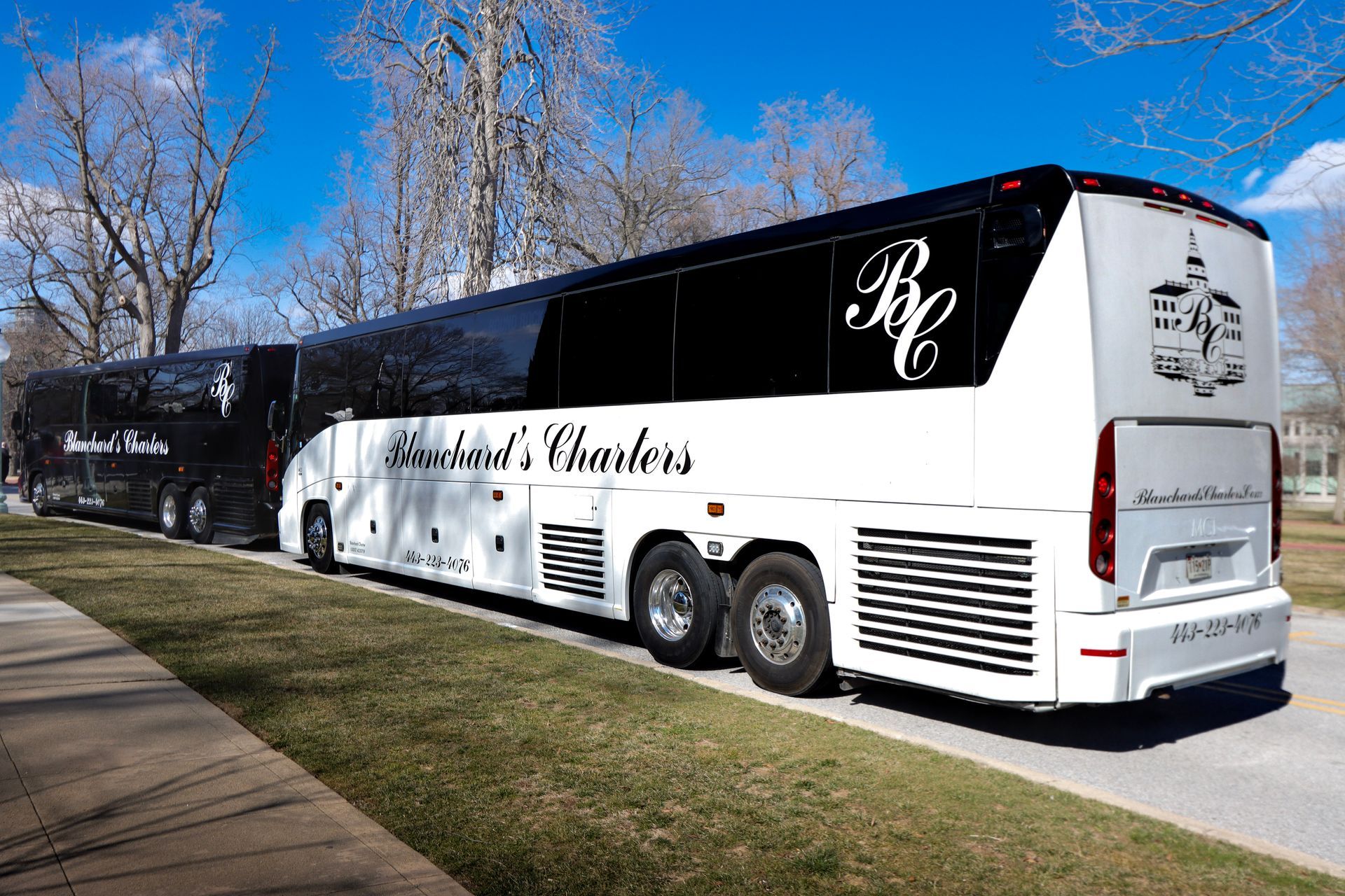 Blanchard Charter 56 passenger charter bus parked on curb