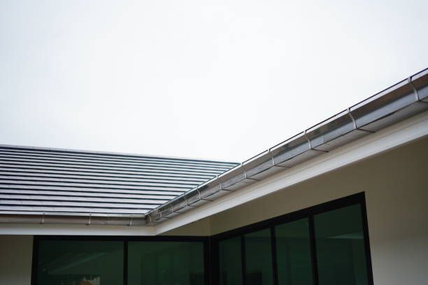 Stainless steel rain gutter on roof