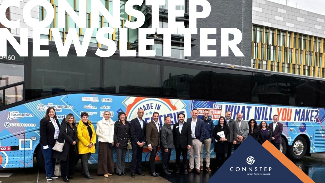 People standing in front of a blue bus with 