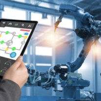 Hand holding a tablet displaying a control interface for a blue robotic arm in a factory setting.