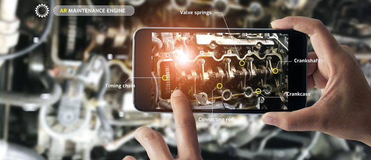 A person using a smartphone with augmented reality to identify car engine parts.