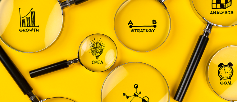 Magnifying glasses over yellow background, highlighting growth, idea, strategy, analysis, and goal concepts.