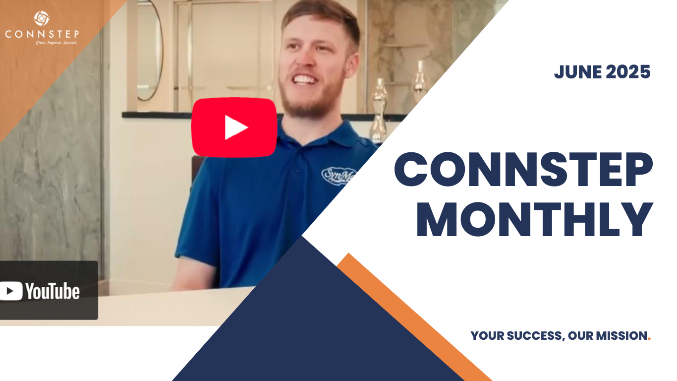 Man in blue shirt smiles, presenting 