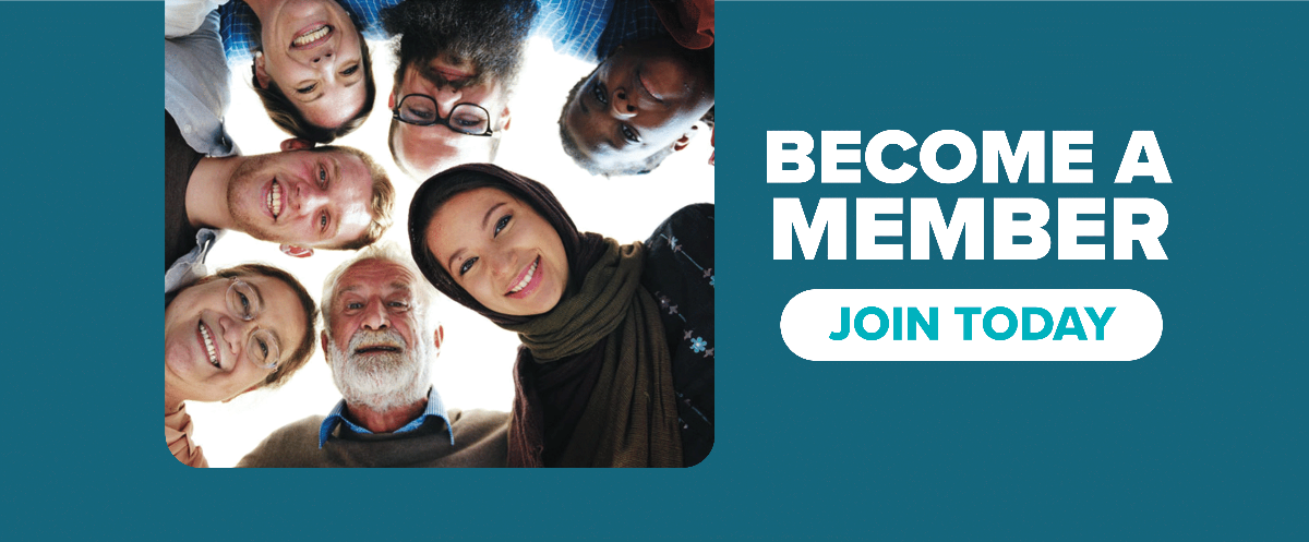 A group of people are standing in a circle looking up at the camera.