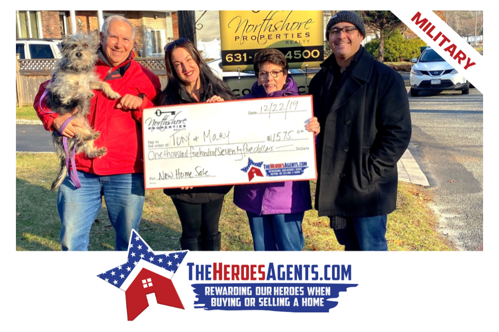 A group of people holding a check in front of a sign that says military