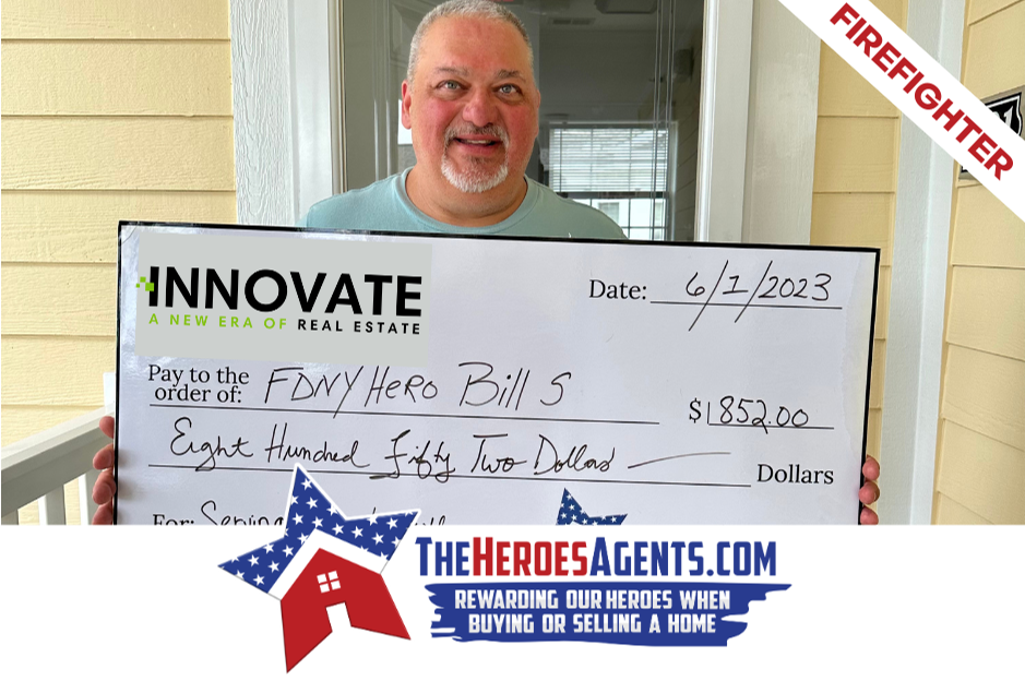 A man is holding a check that says innovate on it