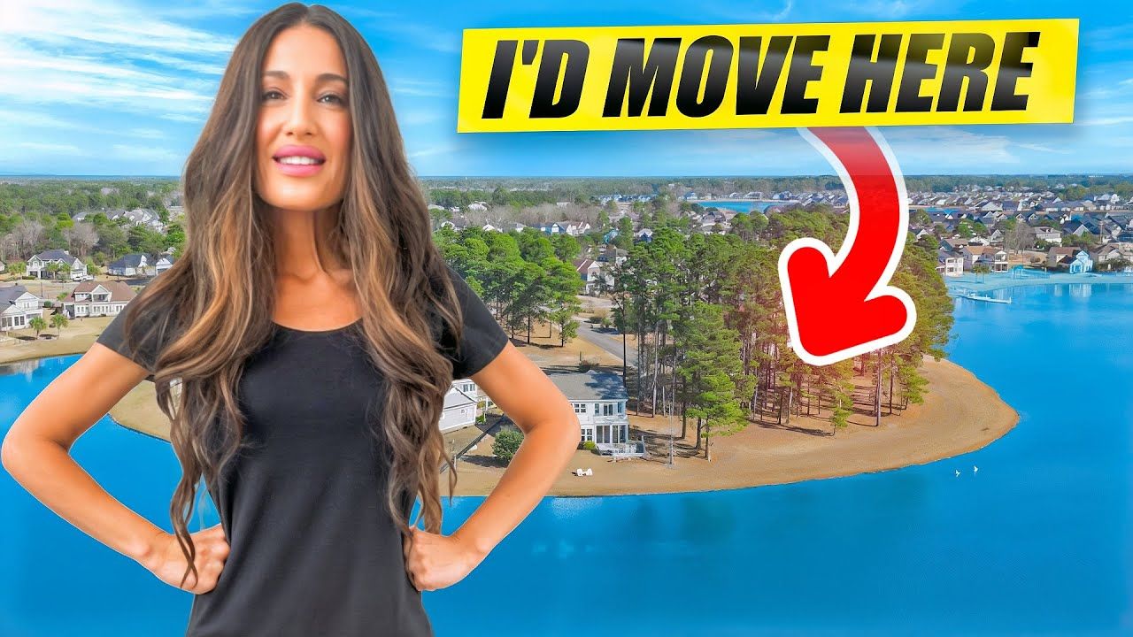 Woman in black shirt gestures toward island houses. Text: “I’D MOVE HERE.” Red arrow points to island.