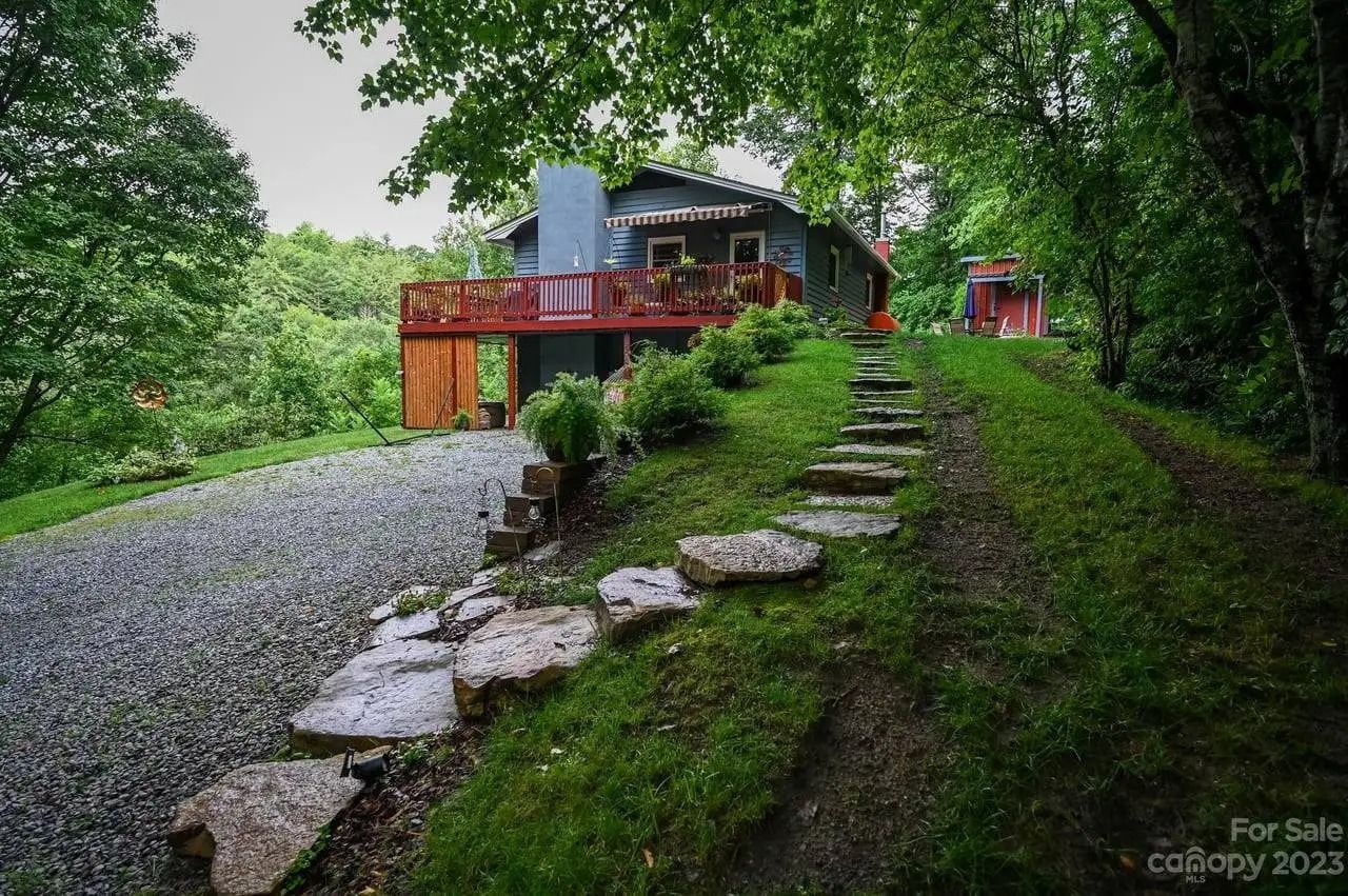 A house for sale with a stone path leading to it