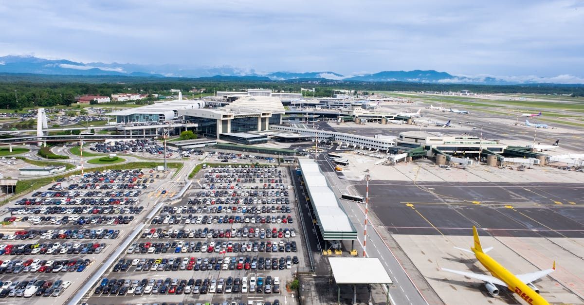 An aerial view of an airport with a plane parked on the tarmac.