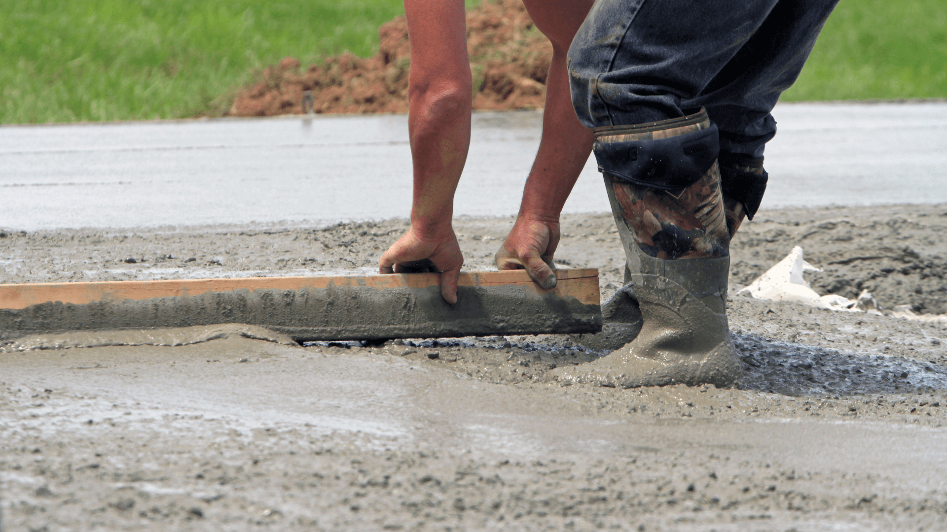 Concrete contractors repairing a garage floor in Cypress