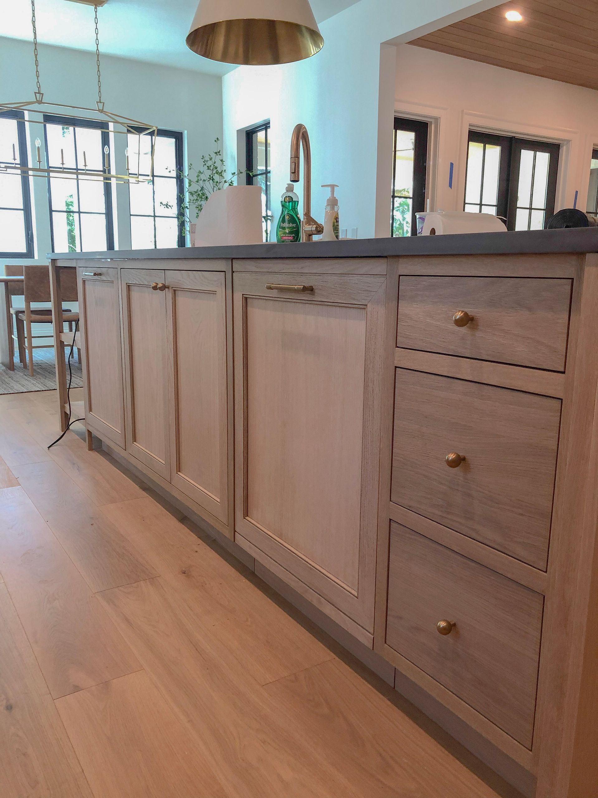 A bathroom vanity is being built in a bathroom.