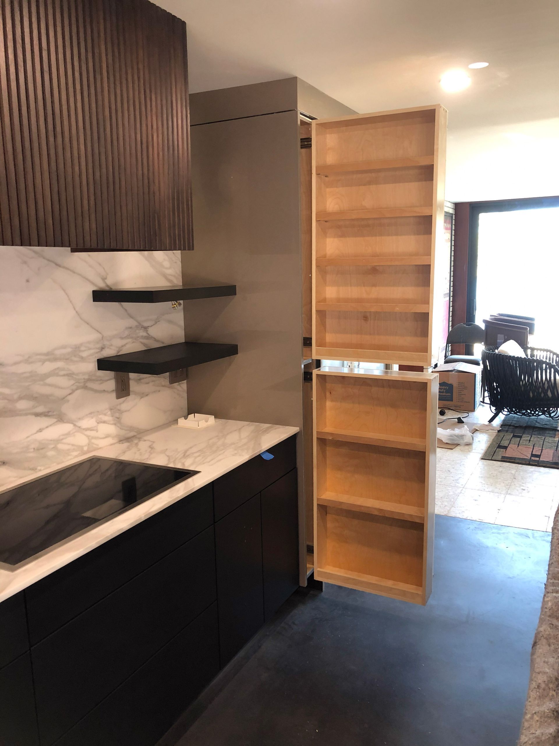 A row of cabinets with glass doors in a room.