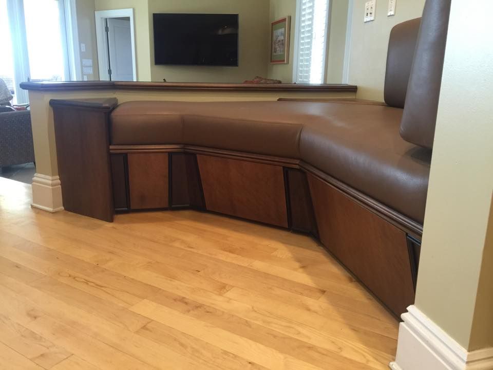 A wooden hood is sitting on top of a wooden table.