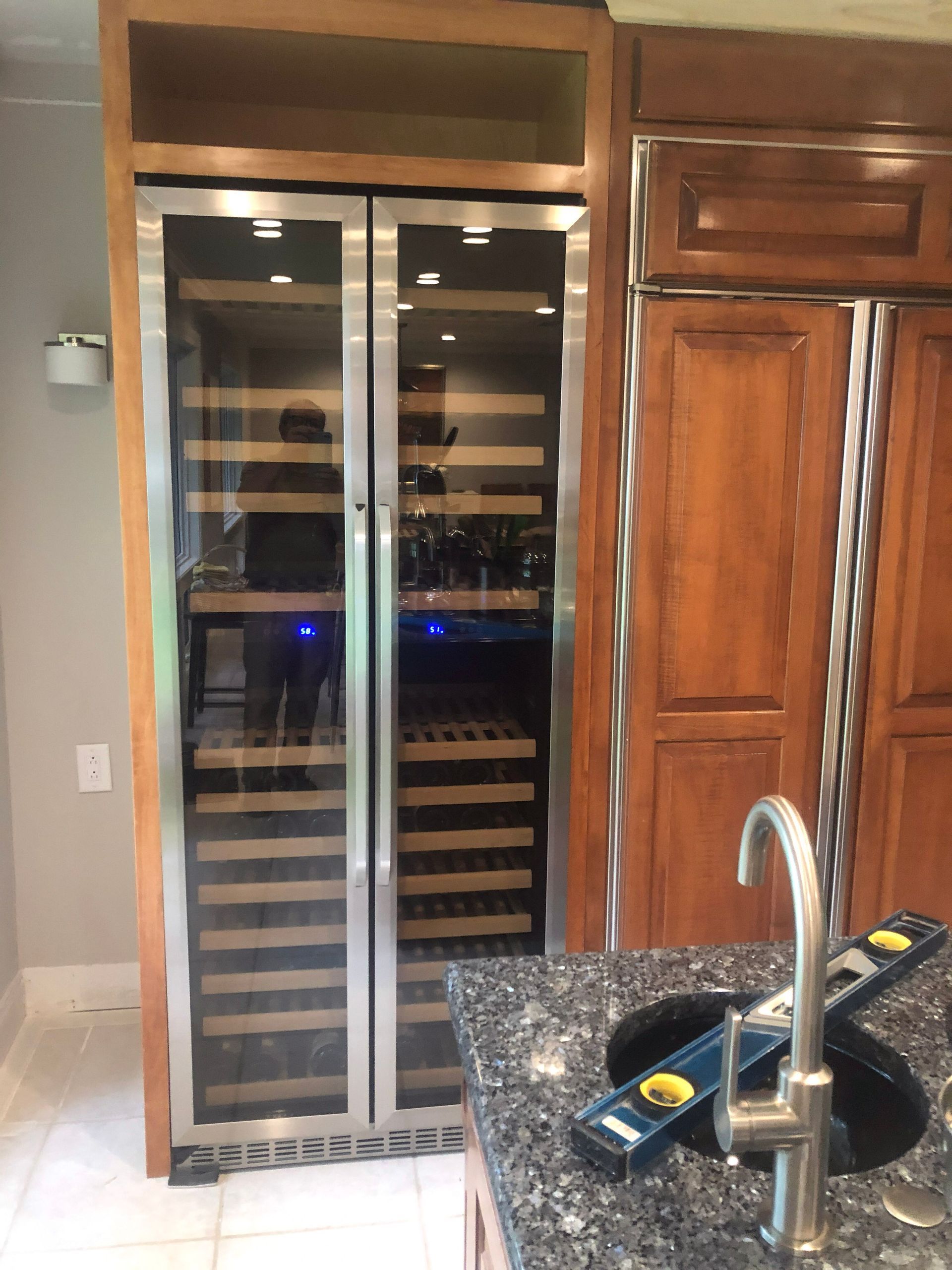 A closet filled with lots of shoes and clothes.