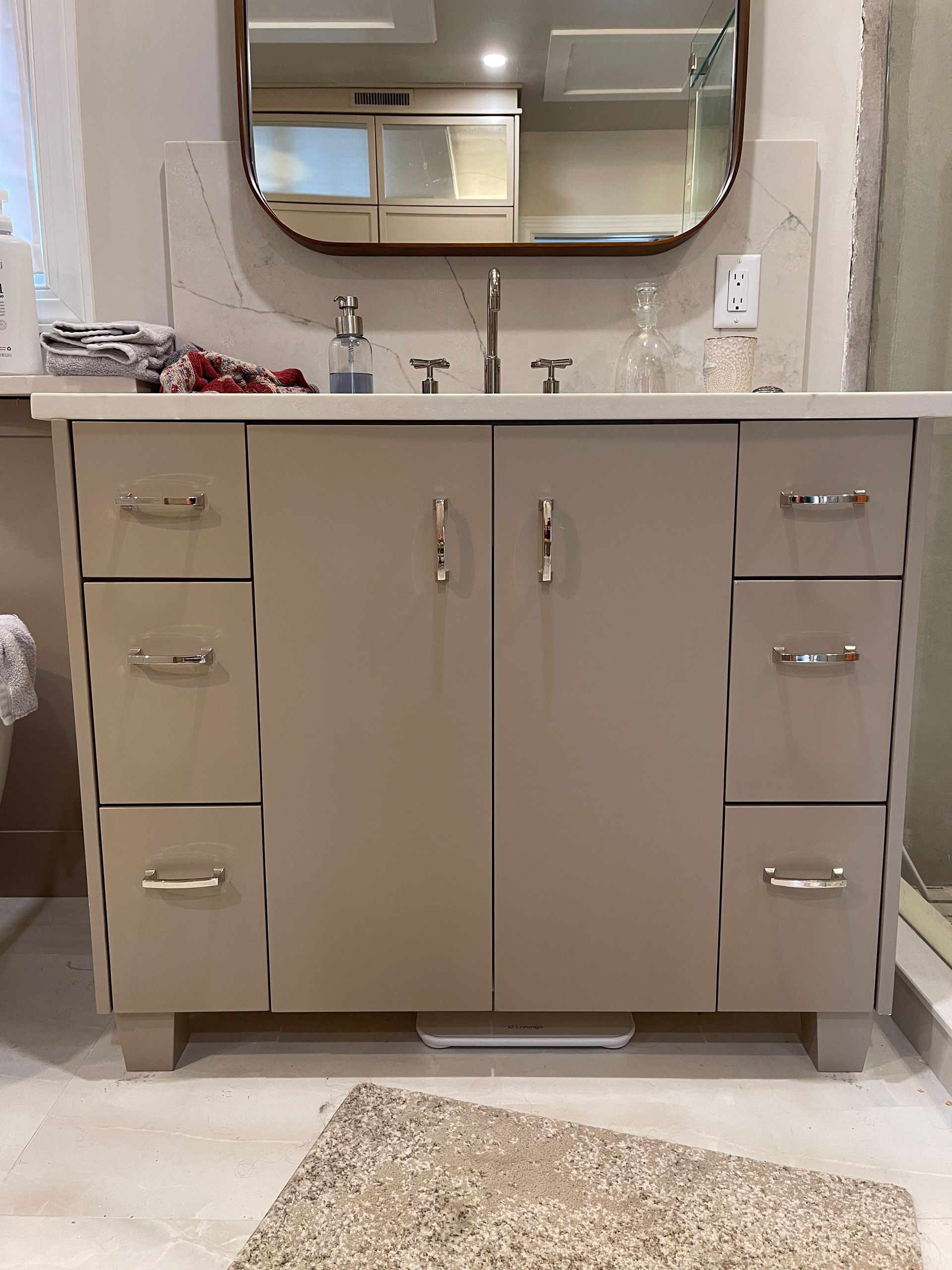 A bathroom with a sink and a box on top of it