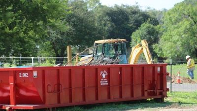 Construction Dumpster Rental — Dump Truck Unloading Dirt in New Braunfels, TX
