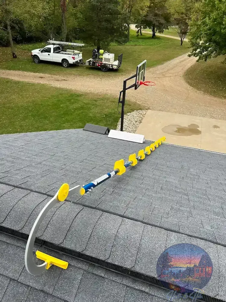 A blue and yellow G.O.A.T roofing pitch ladder