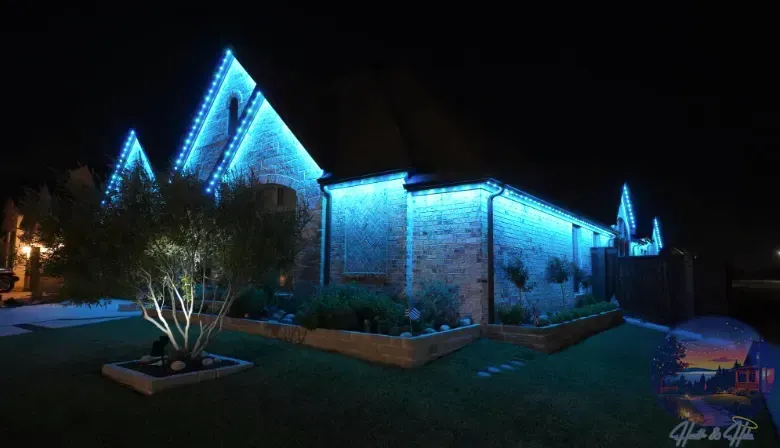 House illuminated with blue lights at night.