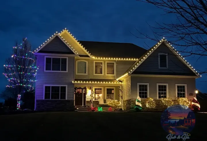 House decorated with Christmas lights at dusk.