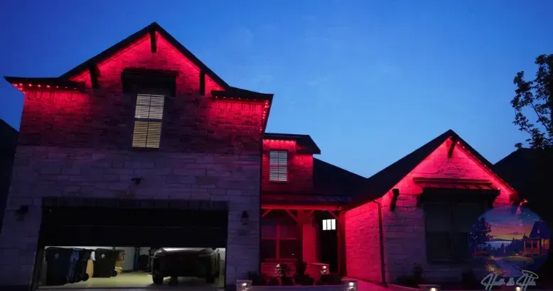 House exterior illuminated with red lights against a twilight sky. Garage door open.