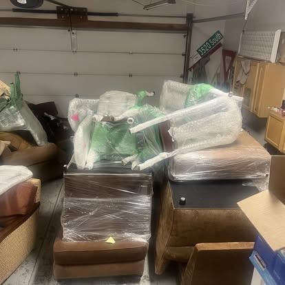 A garage filled with lots of furniture and boxes.