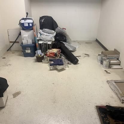 A room filled with lots of trash and boxes.