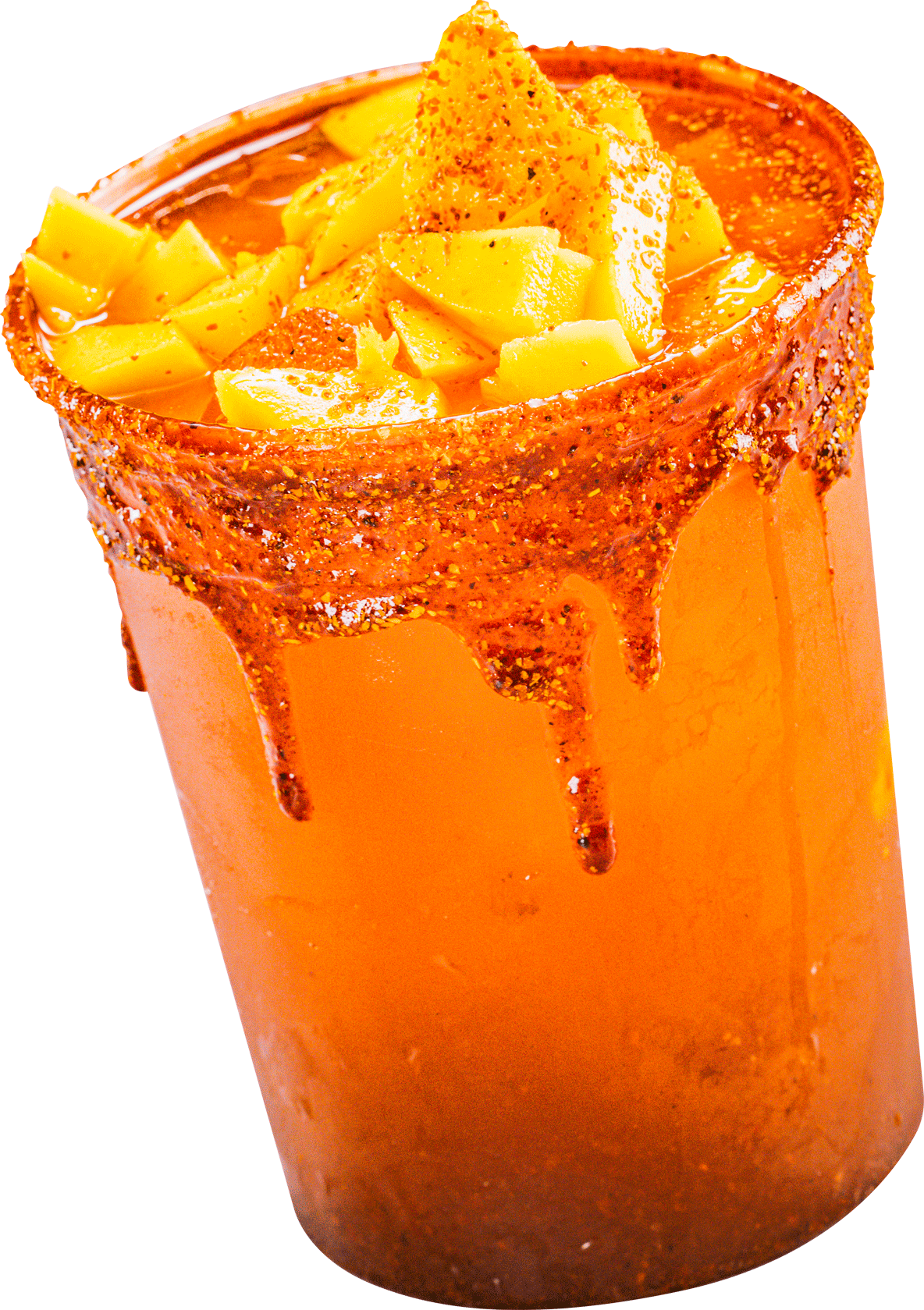 A close up of a cup of orange liquid with slices of mango on top.