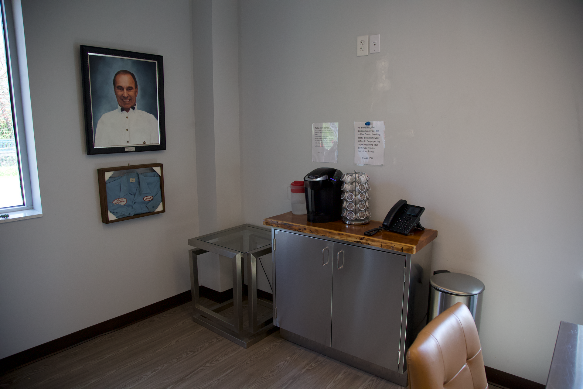 There is a picture of a man on the wall in the room.