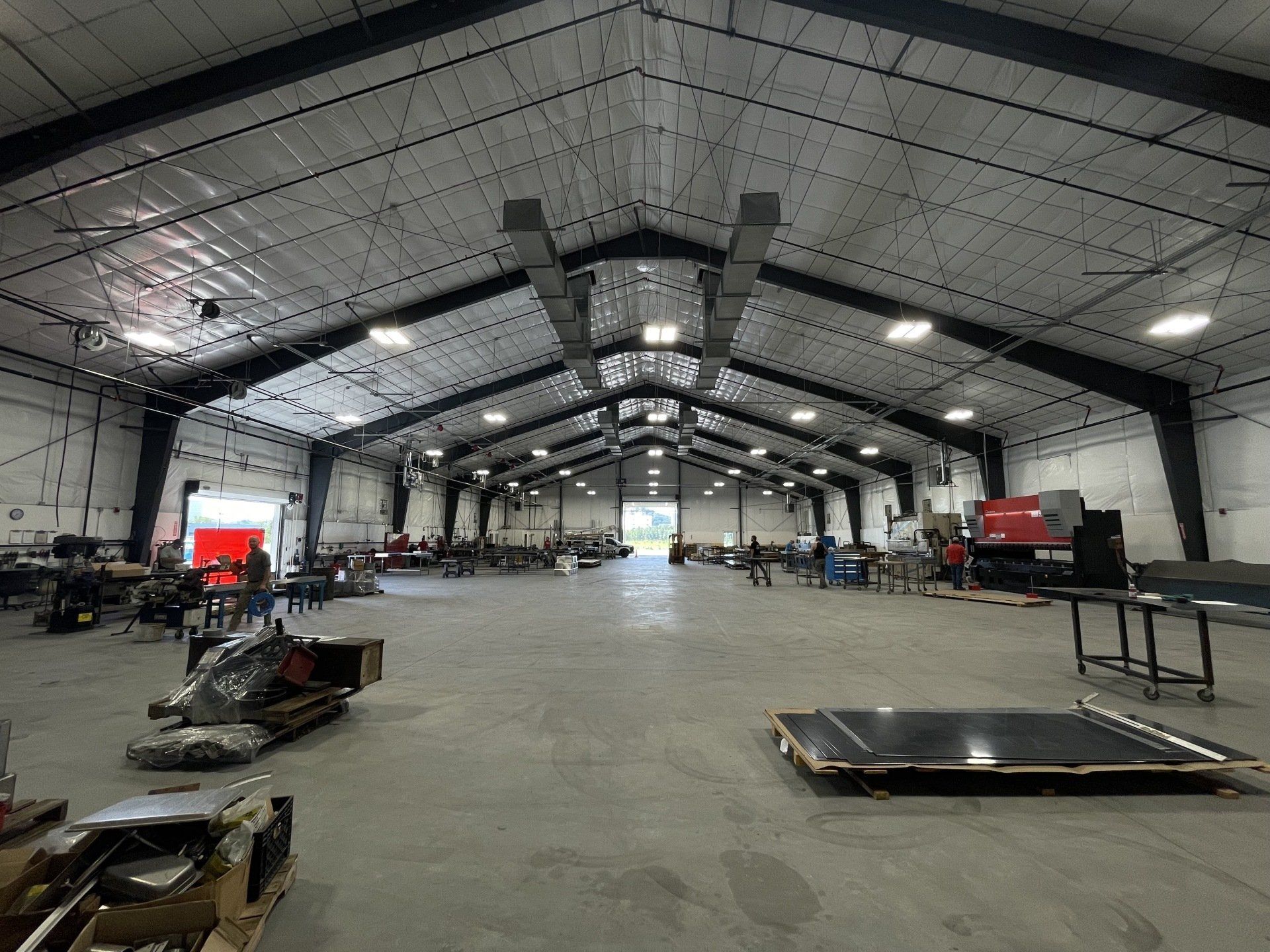 A large warehouse filled with lots of machinery and equipment.